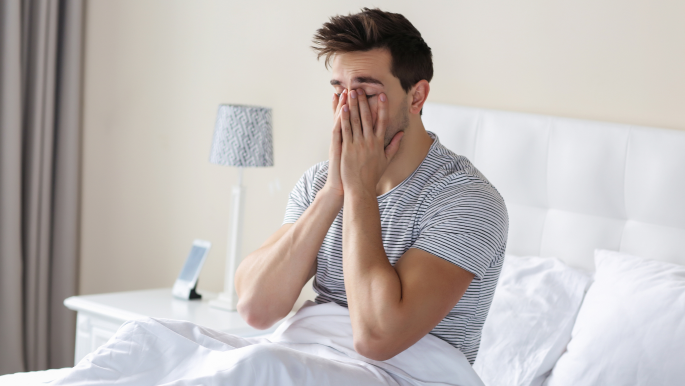 Woman stretching in bed in the morning